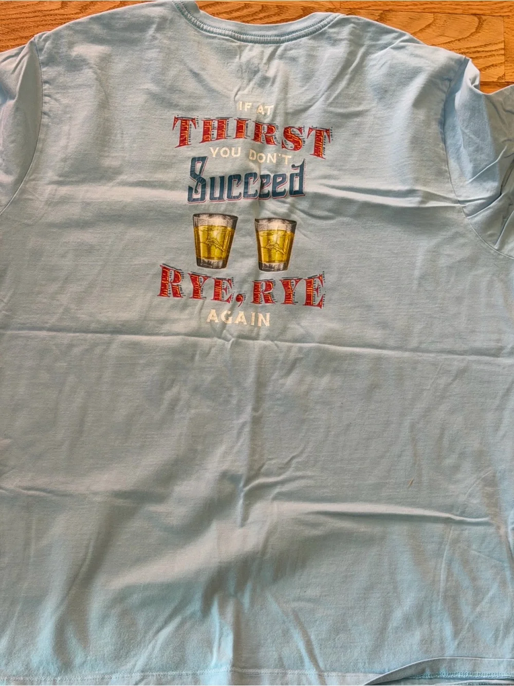 Tommy Bahama Light Blue Graphic Tee with Red and Yellow Print